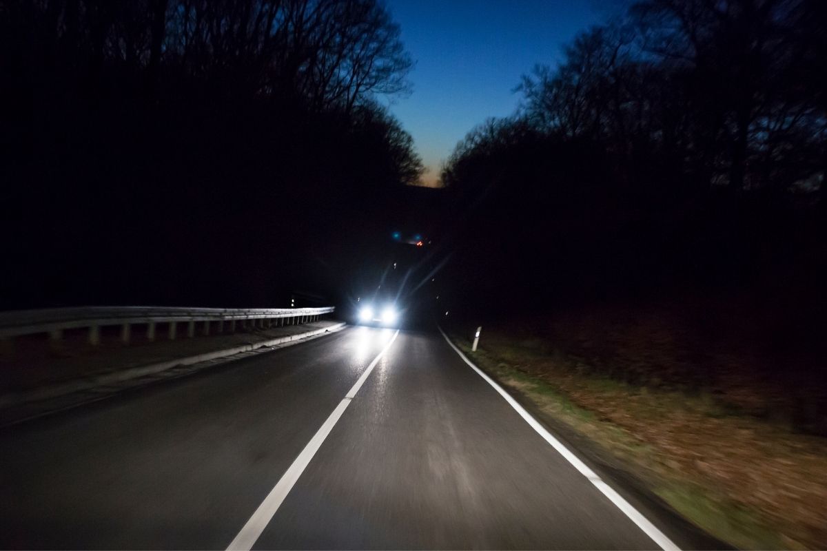 Approaching car in highway at night using HID led headlight in high beam mode