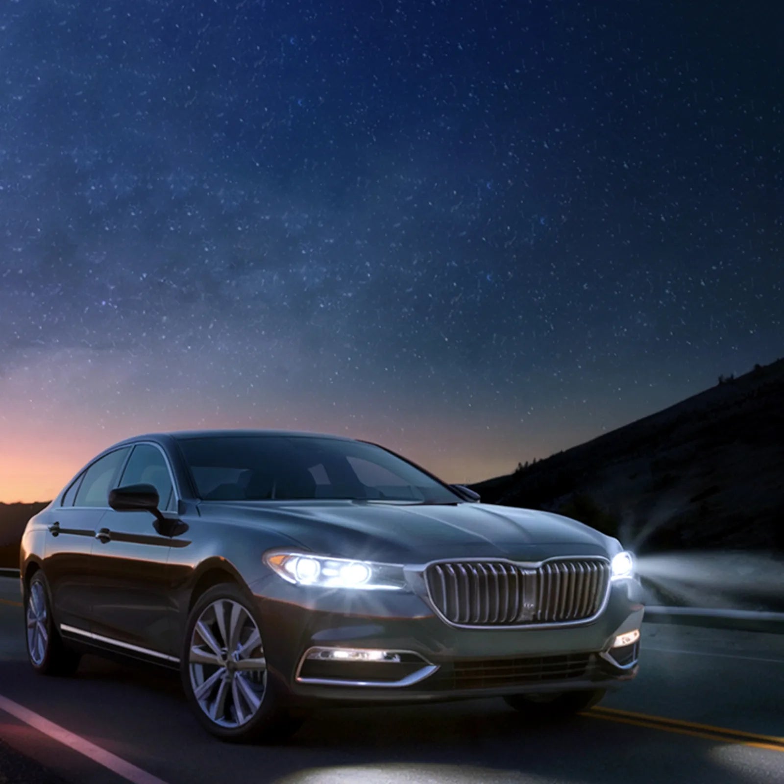 Car on a road with a starry night sky