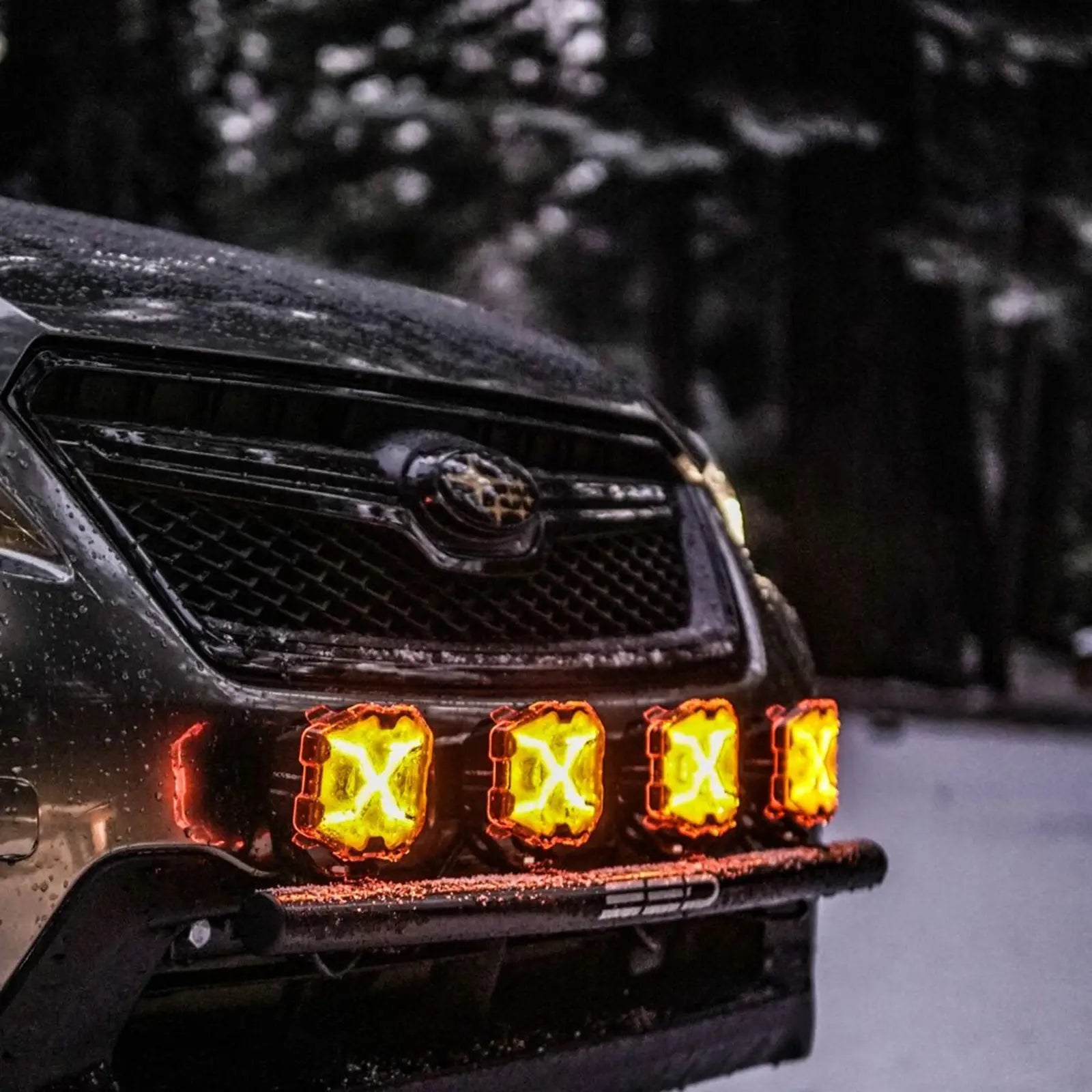 Car with novsight X series amber LED lights on a snowy road
