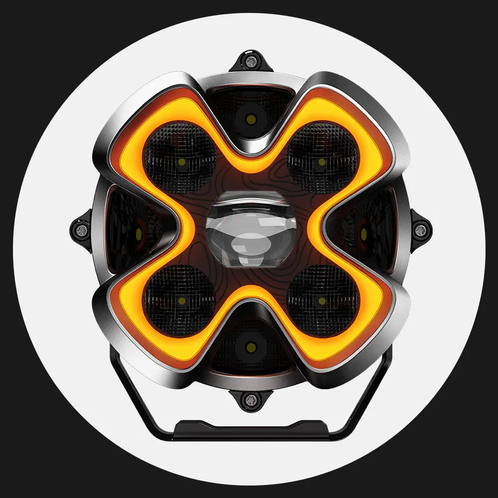 Circular headlight with orange and black design on a white background