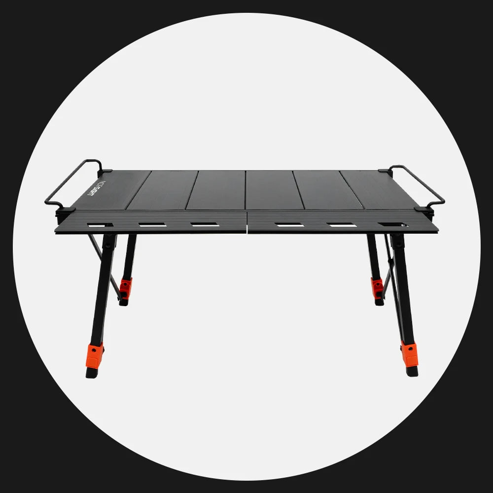 Black camping table with orange accents on a white background