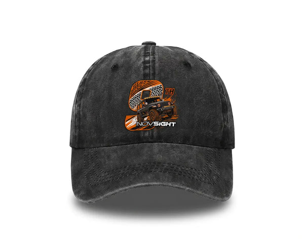 A dark gray washed baseball cap featuring an orange and black graphic of an off-road vehicle with the text 'NO SIGHT' on the front, set against a plain white background.